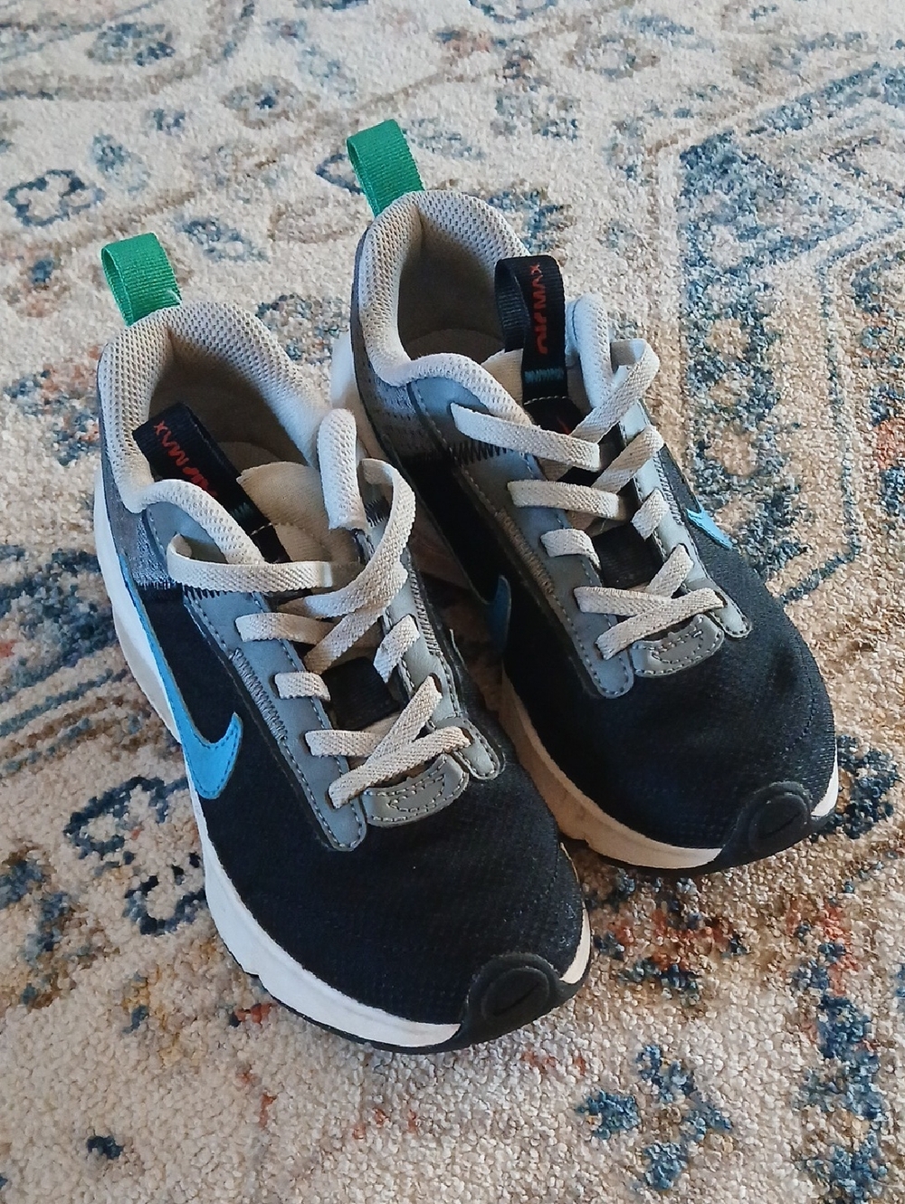 Nike Kids Black Sneakers with Blue Swoosh and Green Pull Tabs